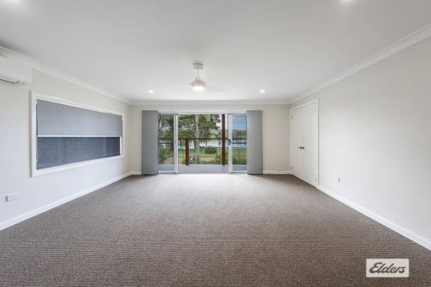 RENOVATED EXECUTIVE RIVERFRONT HOME - Photo 1