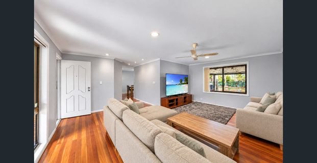 Spacious Family Home with New Carpets, Massive Pool & Outdoor Entertaining! - Photo 1