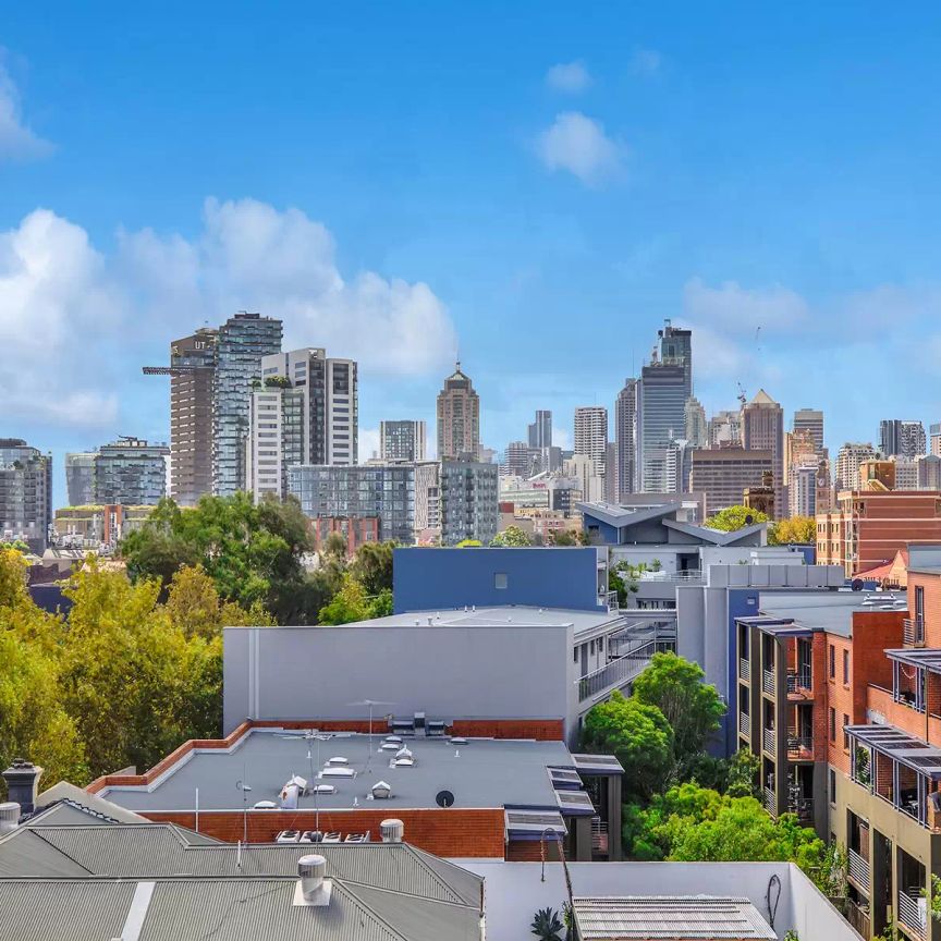MODERN SPLIT LEVEL APARTMENT WITH SWEEPING CITY VIEWS - Photo 1