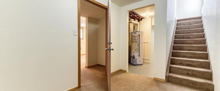 Basement suite with 1 bedroom, 1 full bath, and a kitchenette area | 79 Abalone Way Northeast, Calgary - Photo 1