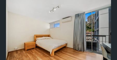 Modern 1x1 Apartment with River, City & Park Views - Photo 4