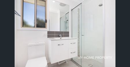 Freshly Painted Modern Apartment with New Carpet in Prime Location - Photo 4