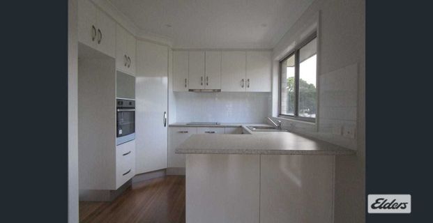 Stylish Four-Bedroom Home with Contemporary Features - Photo 1