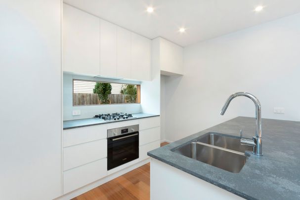 Modern Two-Bedroom Townhouse in a Prime Location - Photo 1