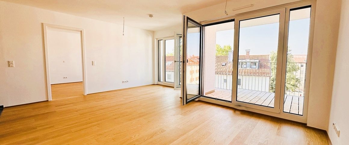 Hoch hinaus in der chicen Stadtwohnung mit sonniger Dachterrasse und Einbauküche! - Photo 1