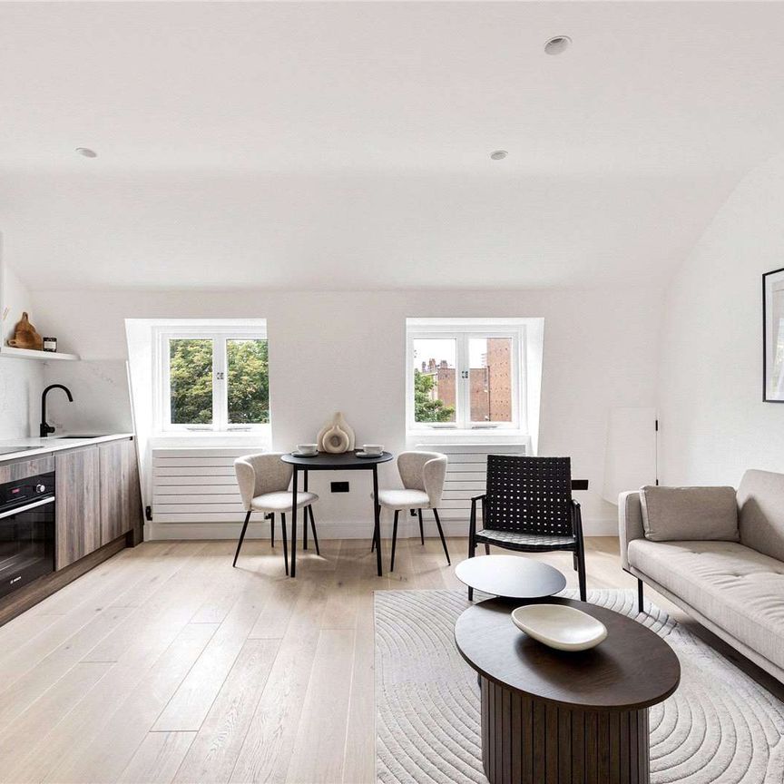 An impeccably designed top floor, 1 bedroom apartment with ample storage. - Photo 1