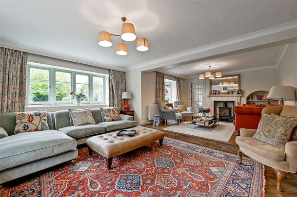 A beautifully presented detached home with private driveway, double garage and fully furnished interiors including five bedrooms in village setting - Photo 1