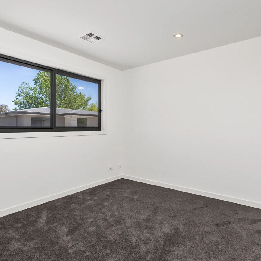 Stylish, Light-Filled Townhouse with Private Garden in Prime Inner North Location - Photo 1