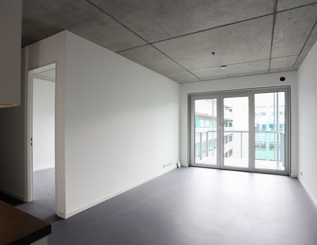 Ab sofort - Helle Neubauwohnung im 6. OG mit Sichtbetondecken, EBK und Smart Home-Features - Foto 1