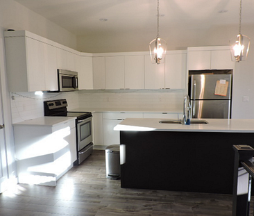 Newly Built 3 Bedroom Main Floor with Garage - Photo 1