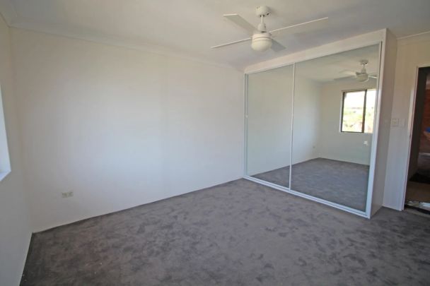 SPACIOUS 2 BEDROOM APARTMENT WITH TANDEM GARAGE - Photo 1