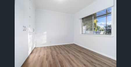 RENOVATED TWO BEDROOM UNIT WITH MODERN COMFORTS - Photo 3