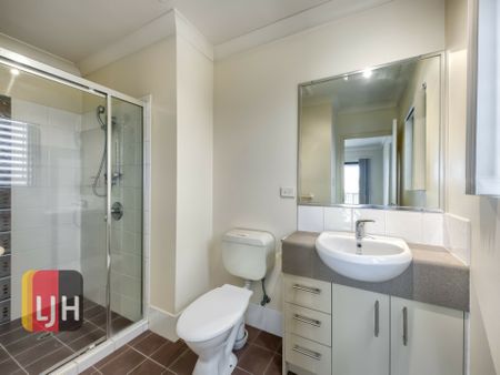 TOP FLOOR THREE BEDROOM UNIT WITH DOUBLE GARAGE & LARGE DECK! - Photo 2