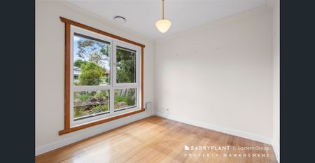 Renovated Charm with Modern Comforts and Sustainable Living - Photo 3