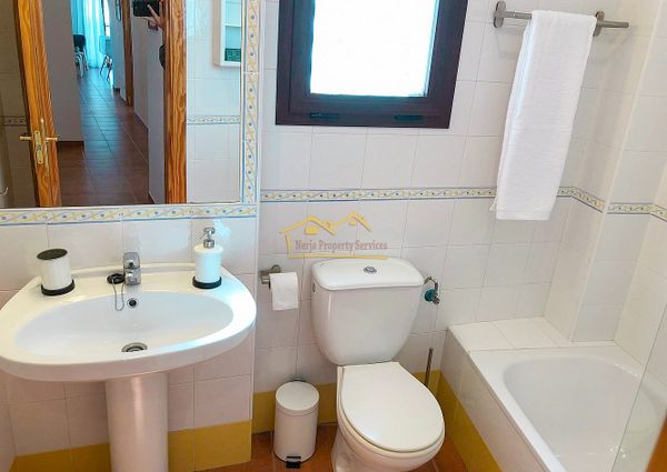 Bright 3-Bedroom Apartment with Parking and Pool, Available for Long-Term Rental in Frigiliana