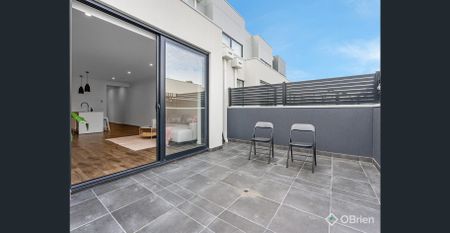 Stylish Townhouse Offering Space, Comfort, and Convenience - Photo 4