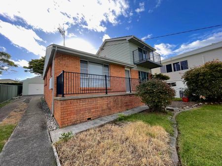 Freshly Updated Home with Water Glimpses & Spacious Yard - Photo 4