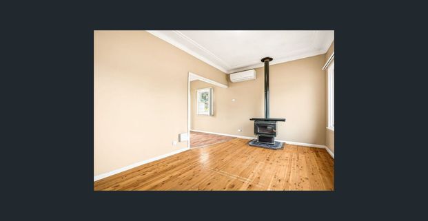 Spacious 3-Bedroom Home in a Prime Location - Photo 1