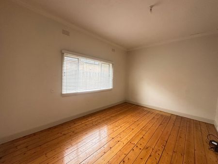 Spacious 3-Bedroom Home with Sunroom & Great Backyard - Photo 2