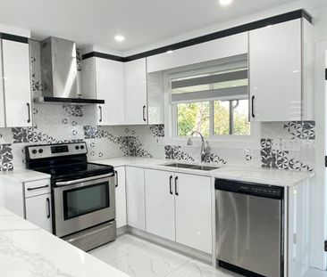 Gorgeous Renovated Home with 2 Kitchens! - Photo 3