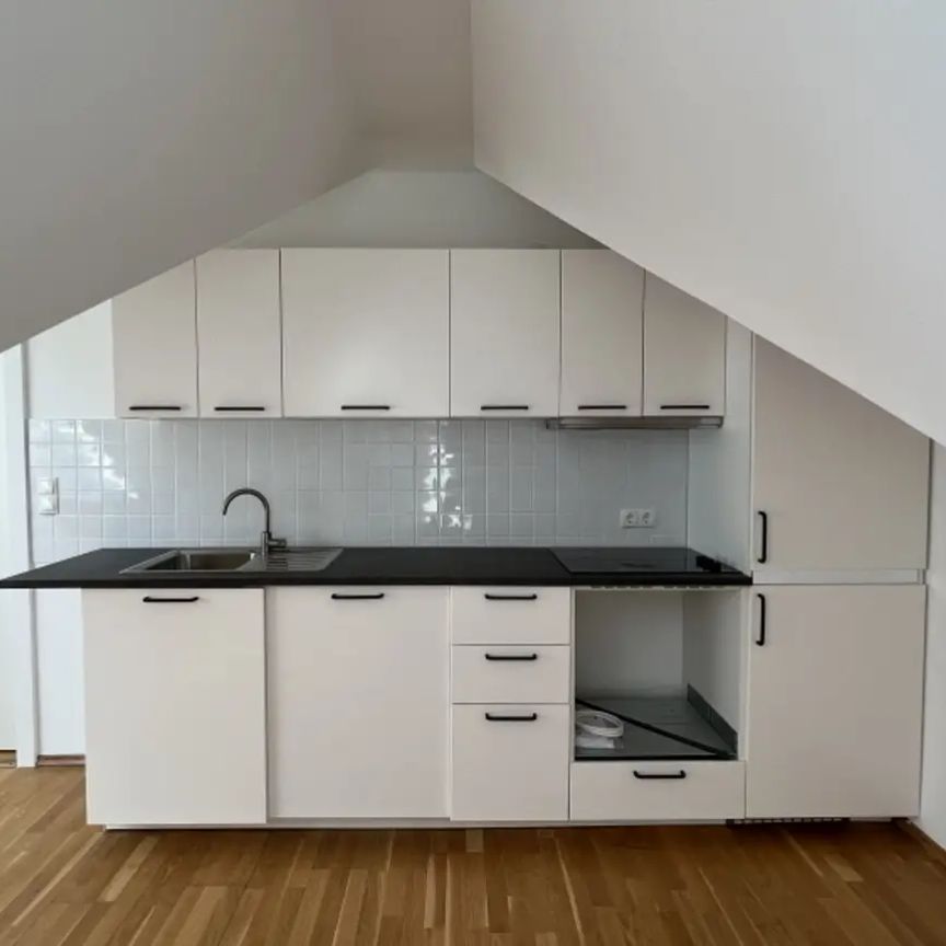 Gut aufgeteilte Dachgeschosswohnung in zentraler Lage - Foto 1