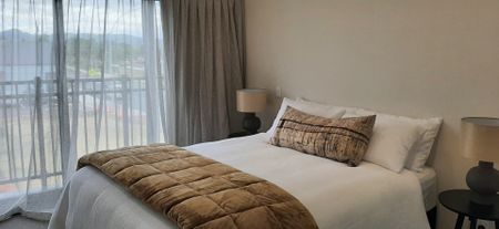 Fully furnished, this stunning two bedroom, two bathroom apartment with open plan living, dining and kitchen is waiting for you! - Photo 5