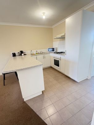 Tidy Unit in a Gated complex with sparkling pool! - Photo 1