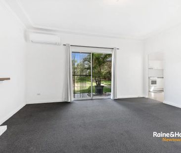 “Tidy solid home with a lush backyard” - Photo 4