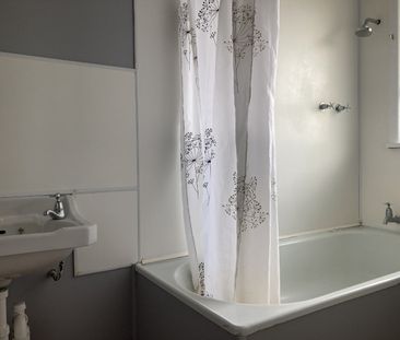 This two-bedroom unit offers comfortable, low-maintenance living in... - Photo 3