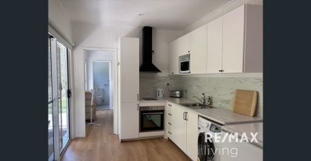 Modern furnished 1-bedroom unit - peaceful, private and stylish - Photo 2