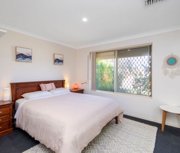 Super Fresh 4 Bedroom Home with Ideal Outdoor Entertaining Area - Photo 1