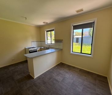 Neat Three-Bedroom Home in Prime Location - Photo 5