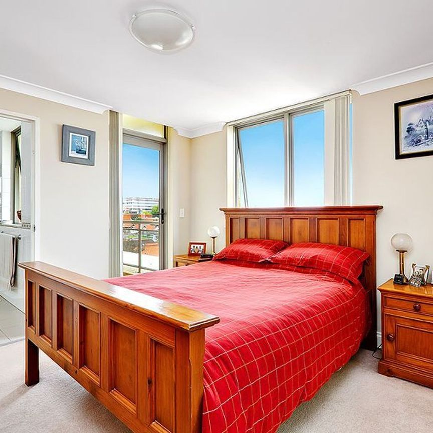 PENTHOUSE STYLE 2 BEDROOM APARTMENT WITH DOUBLE GARAGE - Photo 1
