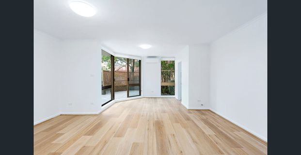 TWO BEDROOM APARTMENT WITH ENTERTAINERS COURTYARD - Photo 1