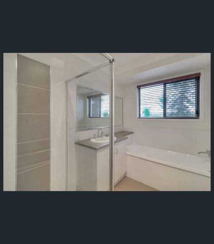 Spacious Four-Bedroom Family Home in Prime Middle Ridge Location - Photo 4