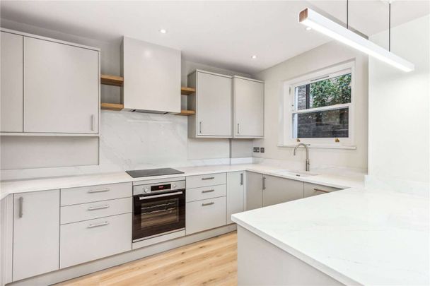 A wonderful three bedroom flat within an imposing Victorian house situated on this popular road, The Chase, benefitting from a superb private garden. - Photo 1