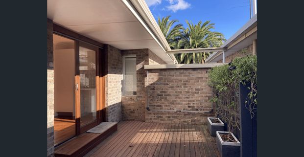Stylish Renovation with Private Courtyard and Prime Position - Photo 1
