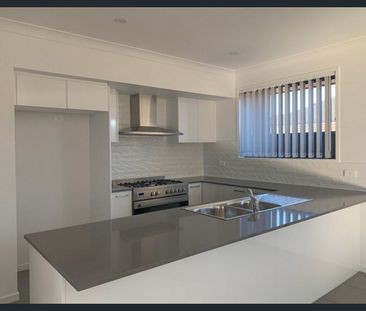 Modern 4-Bedroom Family Home – Lawn Maintenance Included - Photo 5