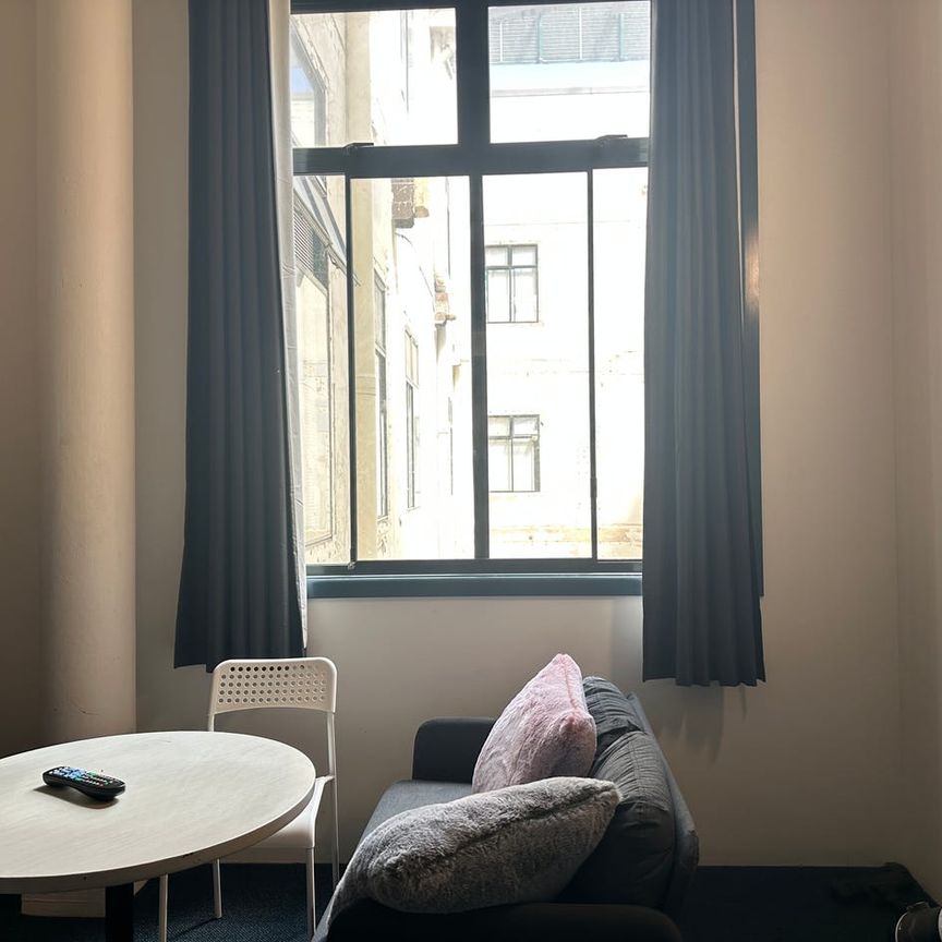 Spacious Loft-Style Studio | Fully Furnished | Prime Broadway Location - Photo 1