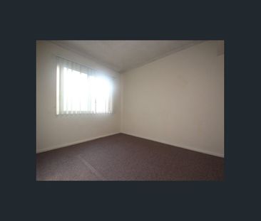 Well Presented Two Bedroom Apartment with Lock up Garage - Photo 4