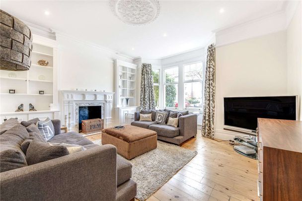 A handsome five bedroom detached family home in a desirable residential street in West Putney benefiting from off-street parking and a private garden. - Photo 1