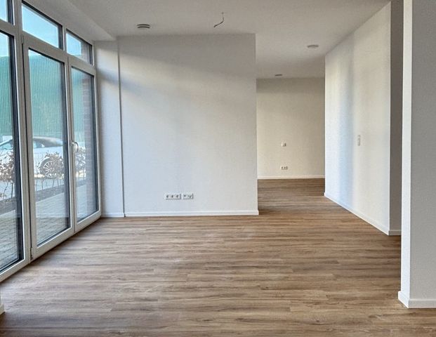 Erstebezug: Schöne Erdgeschosswohnung direkt am Norder Tief! - Foto 1