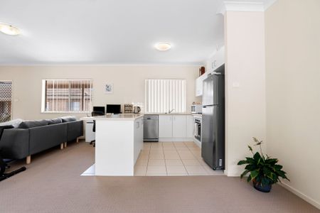 Nestled in a peaceful complex, this delightful two-bedroom unit offers comfort and convenience - Photo 5