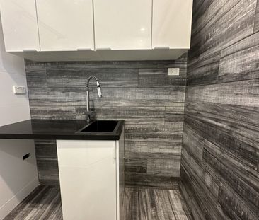 UPDATED UNIT BY THE BEACH - Photo 3