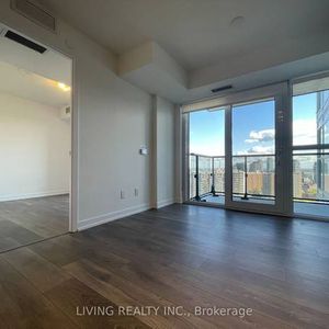 Feels brand new floor to ceiling windows + den! - Photo 2