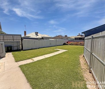 Modern Three-Bedroom Home Close to the CBD - Photo 2