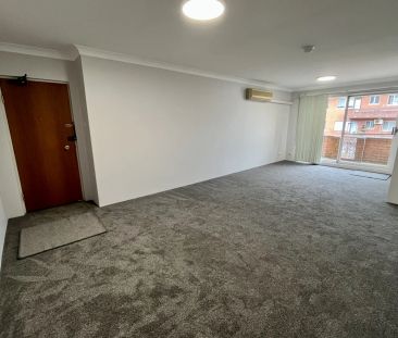 Spacious & Sunlit 2-bedroom unit with lockup garage - Photo 1