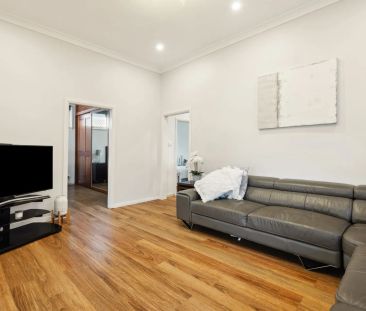 Stylishly updated north-to-rear facing home set on a tree-lined street - Photo 3