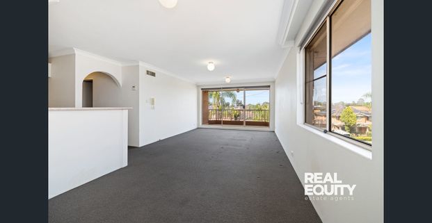 Top-Floor Apartment in a Sought After Lakeside Location - Photo 1