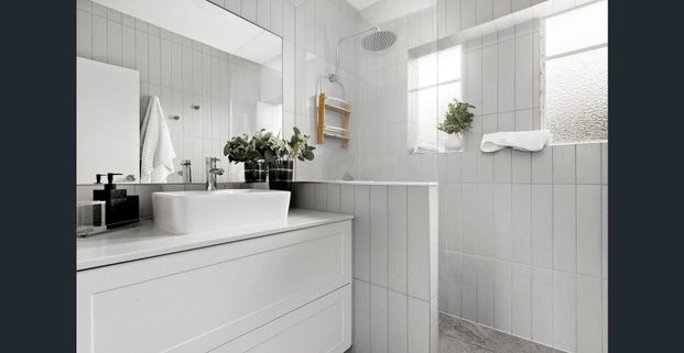 Charmingly renovated on a beautifully manicured block - Photo 1